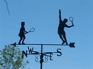Two tennis players weathervane